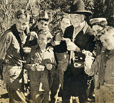 A Boy Scout troop plays host to Hopalong Cassidy. 
