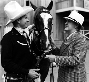 Universal B-Western star Bob Baker and his horse Apache with 
director George Waggner. 