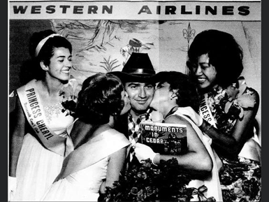 James Drury ("The Virginian") looks very happy as he gets kissed by two pretty Western Airlines beauty queens.