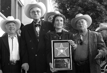 Stuntman Whitey Hughes, Monte Hale, Joanne Hale and Dick Jones at the dedication of Monte Hale's star on the Hollywood Walk of Fame on November 12, 2004.