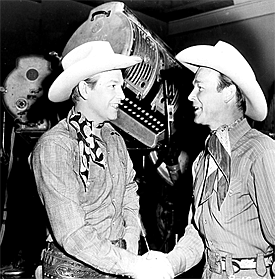Roy Rogers welcomes Rex Allen to Republic during the filming of Rex's "Arizona Cowboy" in 1950. 