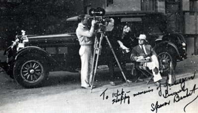 Director Spencer Gordon Bennet sitting beside his Stuz Brougham. Photo was autographed and given to Kirk Alyn while making serials. 