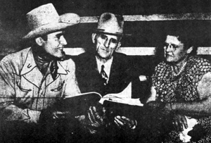 Whip Wilson with his parents, Mr. and Mrs. Charles Meyers, in 1950. 