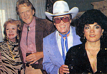 A well done photo montage of two Western greats at the 1986 Golden Boot Awards. 
James Arness and Amanda Blake, Clayton Moore with his wife Connie. 