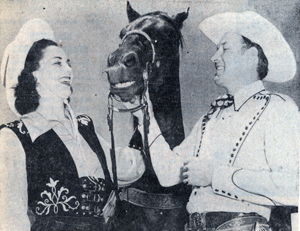 Bill Elliott introduces his horse Thunder to Mardi Boyne during the Sheriff's Rodeo and Congress of Rough Riders in L.A. in September, 1945. 