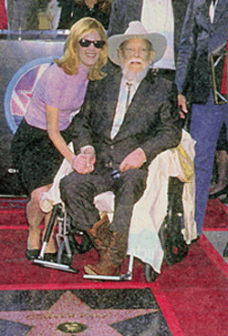 Ailing 77 year old Western legend Denver Pyle is congratulated by actress Michelle Stafford as Denver gets a star on the Hollywood Walk of Fame. Denver died several months later on December 25, 1997. 