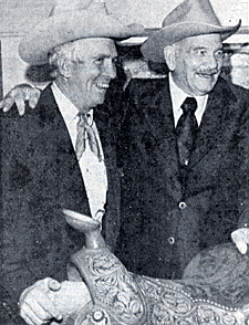 Jim Shoulders, former rodeo great from Henryetta, OK, and Yakima Canutt admire a saddle at the National Cowboy Hall of Fame in Oklahoma City in December 1976. 
