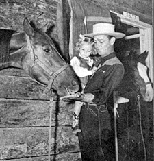 Alan Ladd and his daughter...either Alana or Carol Lee...and the daughter's horse. 