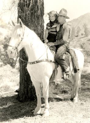 Hoot Gibson and one of his leading ladies (anyone know who this is?). 