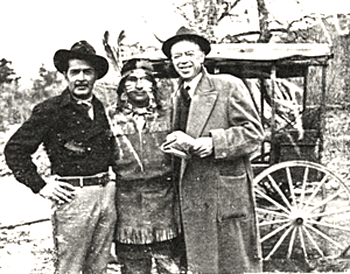 Kent Taylor, star of TV's "Rough Riders", poses Feb. 19, 1959 on location at Vasquez Rocks. Man in the middle is obviously an actor and the man on the right is probably the director, but not sure who.