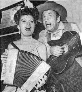 Kathleen O‘Malley, daughter of character actor Pat O‘Malley, gets together for a little music with Universal B-western comic Fuzzy Knight on the set of O‘Malley’s film, “Lady on a Train” (‘45) which starred Deanna Durbin.