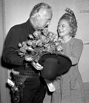 William Boyd as Hopalong Cassidy presents a gorgeous bouquet of roses to Norweigan figure skating champion Sonja Heinie. Heinie won more Olympic and World titles than any other ladies figure skater. (Photo courtesy Bobby Copeland.)