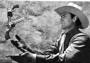 Republic’s B-western star Allan “Rocky” Lane practices his gun tricks in this August 1947 publicity photo.