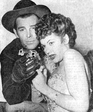 Yvonne De Carlo gets a lesson in gun-handling from Rod Cameron while the couple were co-starring in “Frontier Gal” (‘45 Universal).