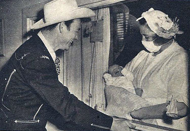 Roy Rogers views his new born son, Roy Rogers Jr., on October 28, 1946. Roy was on route from Chicago at the time of Dusty’s birth. Six days after Roy Jr. was born, Mrs. Arline Rogers became ill and died. (Photo courtesy Bobby Copeland.)