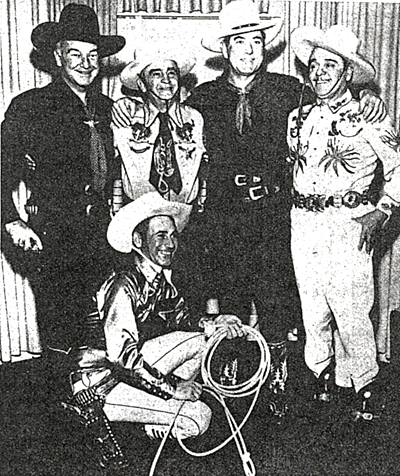 Wild West roper/actor Montie Montana kneels beside Hopalong Cassidy, LA County Sheriff Eugene Biscailuz, Johnny Mack Brown and Leo Carrillo. 