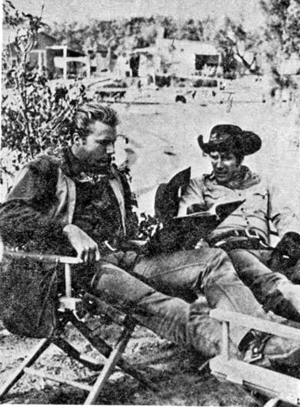 John Smith and Robert Fuller study their script in between scenes of "Laramie".