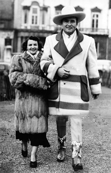 Monogram B-Western star Whip Wilson and his wife Monica walking through Green Park on their visit to London, England on January 6, 1950. 