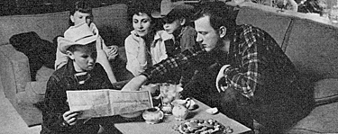 Family vacation in Yosemite called for consultation and lots of map reading
by son Craig, 11, and dad James Arness. Looking on are daughter Jenny Lee, 8, mom Virginia and son Rolf, 7. 