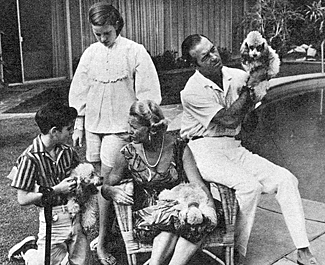 John "Restless Gun" Payne poolside with wife Alexandra (seated) and kids Tom, 10, and Kathleen, 12. 