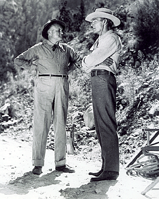 Randolph Scott talks with director George WaGGner on location in Arizona
while filming "Gunfighters" ('47 Columbia). 