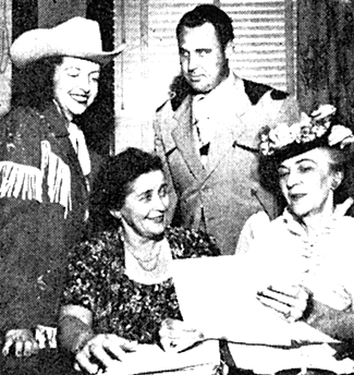 Reading the script for "Osage", a Western that was in production around Pawhuska, Oklahoma in the '60s are Ada and Bob Gilbert (star of the film) and Mrs. Julia Smith (Mrs. Dean's mother). Also, on the right, Ferne King, editor of THE RANCHMAN, who, with Gilbert is a co-producer of the picture. Unfortunately, "Osage" was never released.