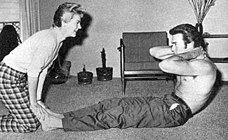 Clint Eastwood exercises in his living room with his wife Maggie.