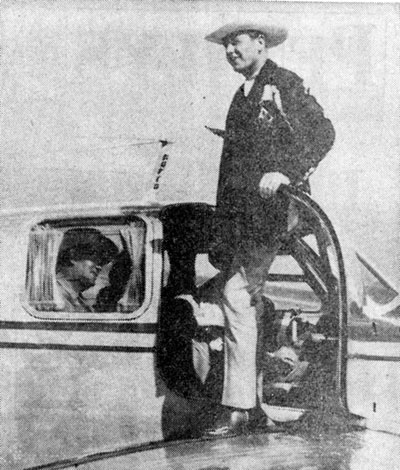 Republic star Rex Allen steps off a plane in Dodge City, Kansas, in May 1952. He was flown to Dodge City for a personal appearance by Glen Cooper, the local drive-in theatre operator. Look closely, inside the plane is badman Roy Barcroft who accompanied Rex for the appearance. (See next photo.)