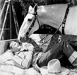 Buck Jones and Silver take a break from filming.