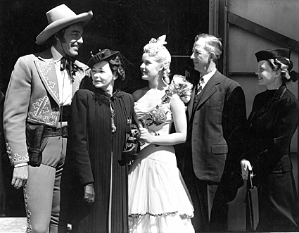 The Cisco Kid...Caesar Romero...meets with a wedding party family.