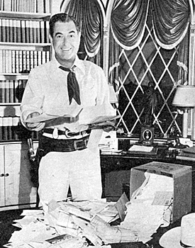Johnny Mack Brown at home with fan mail to answer.