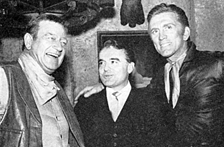 Jack Valenti, President of the Motion Pictures Association (center) with John Wayne and Kirk Douglas on the set of "War Wagon" 12/66.