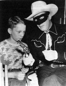 Brace Beemer as the Lone Ranger shows his gun to a fan.
On September 3, 1954 the radio series ended after 3,377 broadcasts in 21 and a half years.