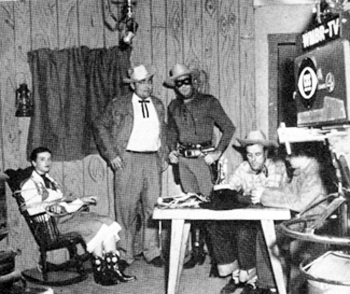 In Jacksonville, FL, in 1956, this poor gal is tied hand and foot for a live telecast from WMBR-TV promoting "The Lone Ranger" movie. Hmmmmmmm...I reckon the Lone Ranger is going to rescue her for TV.