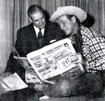 In July 1952, Roy Rogers and Phillip J. Sheridan of the Hearst Newspaper organization look over the Hearst comic weekly “Puck” as they sign contracts for the largest single insertion order of its kind on record. The $75,000 double-truck, four-color spread for Roy Rogers Enterprises as Christmas gift suggestions proposed by 71 firms manufacturing clothing, furnishings, toys and novelties bearing Rogers’ brand ran in “Puck” around Christmas 1952.