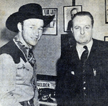 Roy Rogers in 1940 with Larry Stein, District Manager of Warner Bros. Theatres in Illinois, arranging a personal appearance for Roy at the Paramount Theatre in Chicago.
