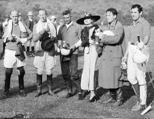 Carole Lombard presents a polo trophy to (L-R) James Gleason, Leslie Howard, Will Rogers, Spencer Tracy and Johnny Mack Brown for their victory over the producers’ team in ‘34 at Uplifters Polo Field in Santa Monica. (Photo from TCM.)