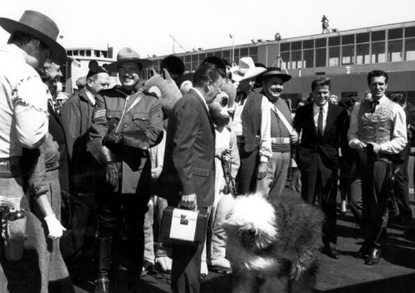 (L-R) Clint Walker (“Cheyenne”), Richard Simmons (“Sgt. Preston”), Tom Tryon (“Texas John Slaughter”), Henry Calvin (Sgt. Garcia on “Zorro”), Edd Byrnes (“77 Sunset Strip”), Hugh O’Brian (“Wyatt Earp”). Not sure of the event, but judging from The Shaggy Dog with his handler and the various Disney characters, it might have been something Disney related. Circa 1959.