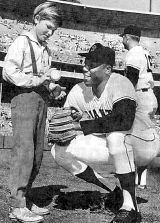 Young Kurt Russell chats with SanFrancisco Giant’s star Willie McCovey at Candlestick Park. Kurt’s dad, actor Bing Russell, an ex-minor league baseball player, coached Kurt’s Little League team. After high school graduation in ‘69 Kurt played minor league ball until ‘73. A promising big league prospect as a second baseman in the California Angels organization, Kurt was leading the Texas League in hitting when he tore his rotator cuff, ending his baseball career. Kurt starred on TV’s “Travels of Jaimie McPheeters” and “The Quest”.