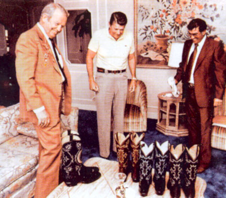 Rex Allen and a Tony Lama representative present President Ronald Reagan with some Tony Lama boots.