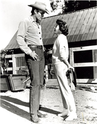 Chuck Connors talks with director Ida Lupino. Lupino directed the “Assault” episode of “The Rifleman” in 1961.