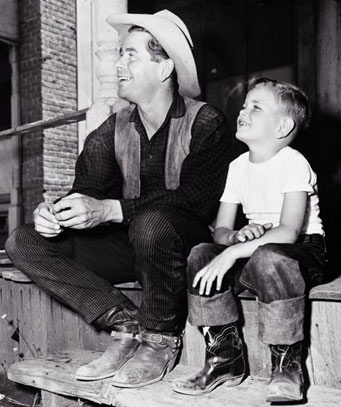 A young Peter Ford visits his dad Glenn Ford on location.