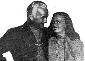 William Boyd (Hopalong Cassidy) and his leading lady Elaine Riley chit-chat during a break in filming “The Devil’s Playground” (‘46 U.A.).