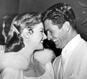 Ann Robinson and Hugh O’Brian share a laugh at a ‘50s soiree.
