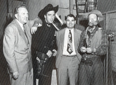 Behind the scenes of “The Dalton’s Women” with Western Adventure Productions distributors Joy Houck (left) and J. Francis White between Lash LaRue and Al “Fuzzy” St. John.