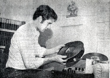 Bob Fuller of “Laramie” in his North Hollywood apartment picking out a few records to listen to. (Thanx to Terry Cutts.)