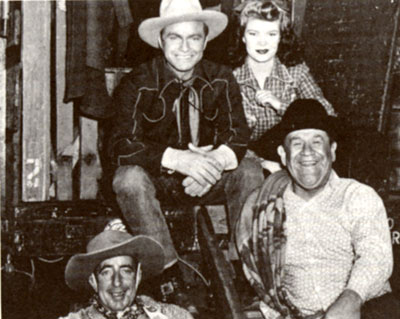 Taking a break from filming Republic’s “Outlaws of Santa Fe” (‘44) are Don Barry, Helen Talbot, Wally Vernon and noted Indian athlete Jim Thorpe.