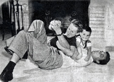 James Arness ambushed at home by sons Craig and Rolfe. (Thanx to Terry Cutts.)