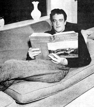 Relaxing at home, James Arness, star of TV's long running “Gunsmoke”, brushes up on his western history by reading a copy of PORTRAIT OF THE OLD WEST by Harold McCracken, first published in 1952.