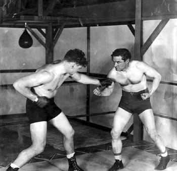 Sparring partners...World Heavyweight Champion from 1919-1926, Jack Dempsey, and Tom Mix. (Thanx to Bobby Copeland.)